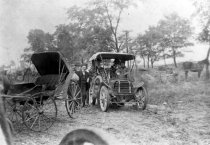Car and buggy on road